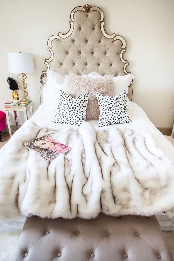 a faux fur pillow and bedspread is a nice idea not only to keep you comfy but also to add glam to your space