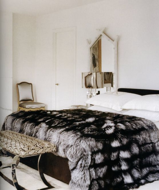 an elegant faux fur blanket adds a textural touch to your space