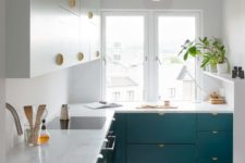 12 an eye-catchy teal and white kitchen with brass touches looks chic and very inviting