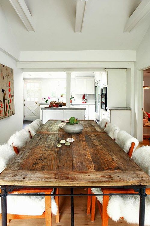 an upcycled wood door turned into a dining table makes a statement in this modern space