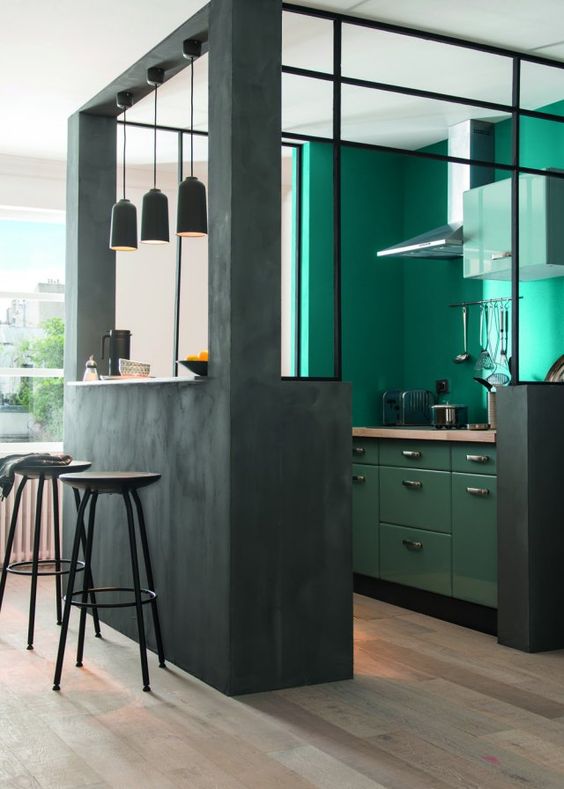 a bold green kitchen corner with turquoise walls for a colorful touch and good mood