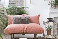 14 a chic loveseat with pink upholstery makes a colorful statement in the space