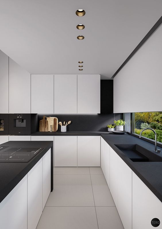 a modern space with white kitchens with matte black counters and a backsplash, no handles and additional lights