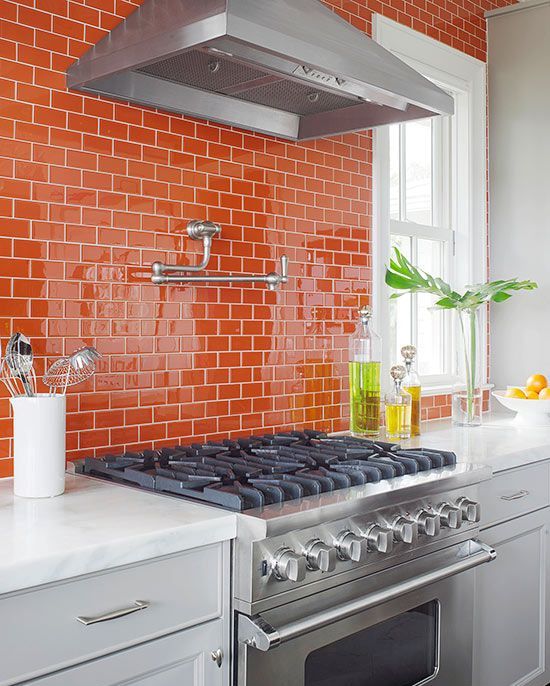 a bold glossy orange tile kitchen backsplash will cheer it up at once
