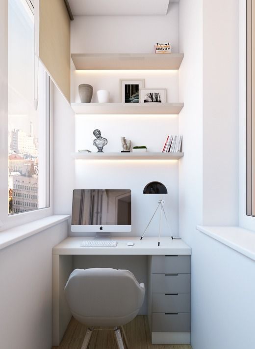 A small workspace in the balcony, a built in desk and shelves with lighting