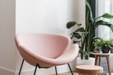 16 a chic and eye-catchy blush chair is a cool touch for any living room