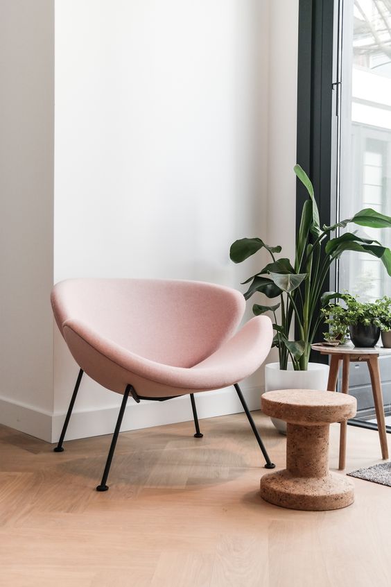 a chic and eye-catchy blush chair is a cool touch for any living room