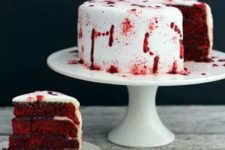 16 a vampire cake in deep red and with blood on the white frosting