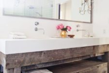 18 a large reclaimed wood vanity with a white countertop looks very modern and cozy