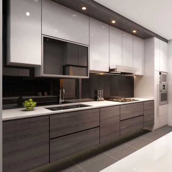 a contrasting kitchen with white and wooden cabinets and a sleek black glass backsplash
