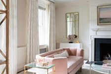 19 a modern serene living room with a geometric blush sofa and brass touches