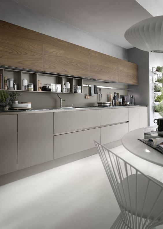 a chic grey and wood kitchen looks very eye-catchy and wood adds texture