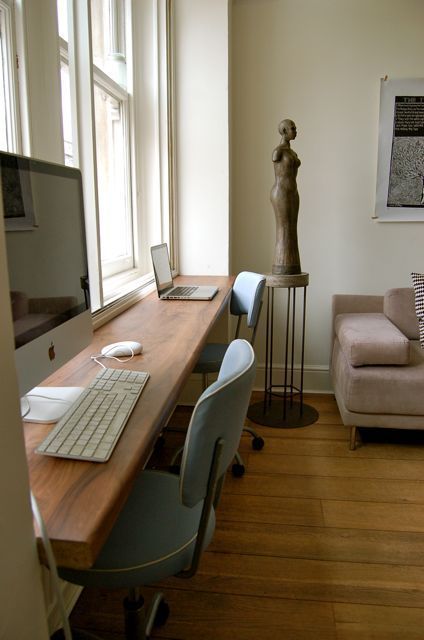 a long windowsill is used as a double workspace