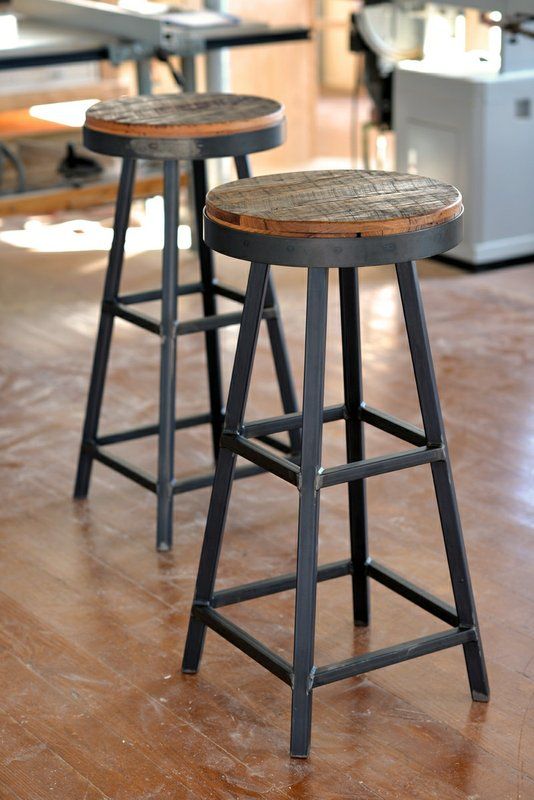 reclaimed wood stools with black metal framing add both a rustic and an industrial feel