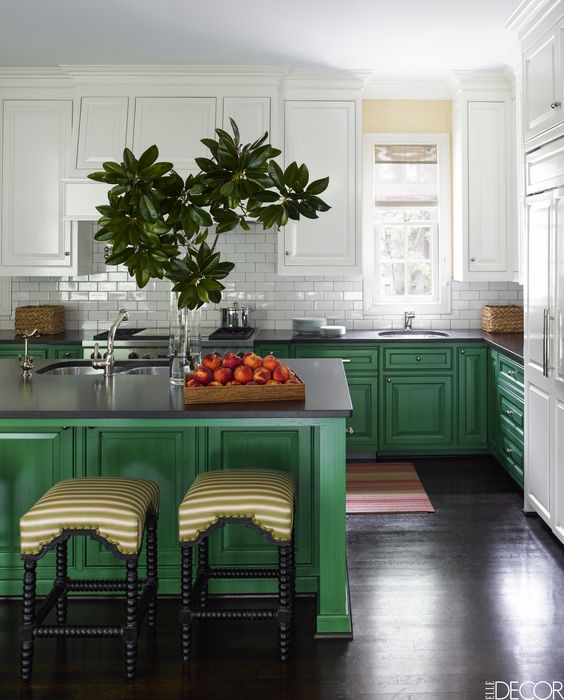 bright green cabinets and a kitchen island are balanced with white cabinets and a backsplash