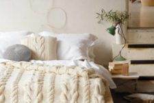 24 chunky cable knit pillow, bedspread and an ottoman for the coziest bedroom look and feel