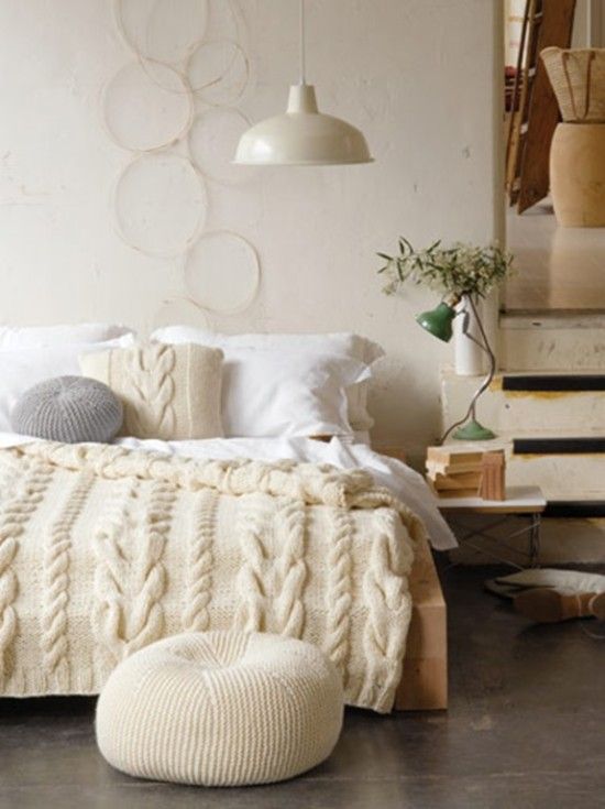 chunky cable knit pillow, bedspread and an ottoman for the coziest bedroom look and feel