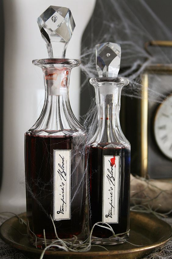 Gorgeous idea for Halloween   pour some red wine into elegant bottles