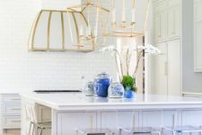 25 large brass lamps and a hood with a touch of brass are bolder than stainless steel chairs