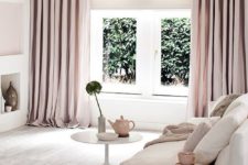 26 a modern neutral living space with dusty pink curtains to add a pastel touch