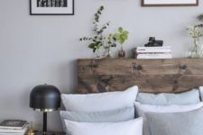 26 a stained reclaimed wood headboard to cozy up the space