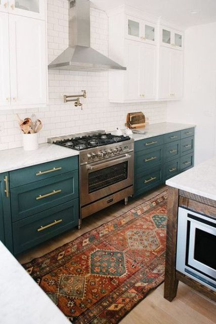 dark green cabinets contrast white cabinets and tiles and create a chic vintage-inspired kitchen