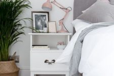 27 a blush lamp adds a cute colorful touch to the grey and white bedroom