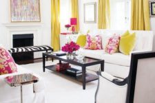 a chic and bold white space is made more colorful with yellow and fuchsia, and black highlights the decor