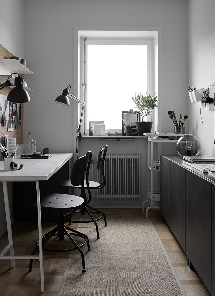 This IKEA home office is monochromatic and decorated completely using IKEA items, the space is shared