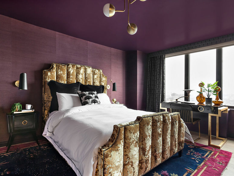 This stunning bedroom done in purple and gold is in a gorgeous art deco apartment and it's sure to take your breath away