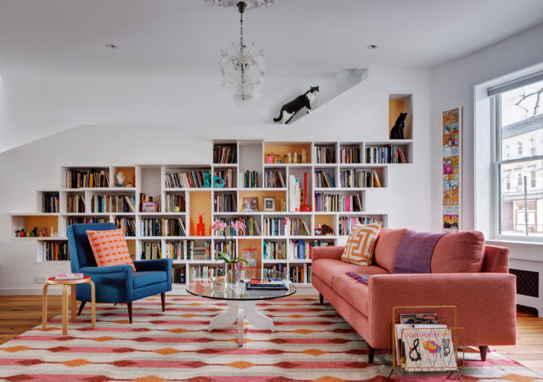 This unique and colroful house was renovated for a couple of booklovers and their two cats, and it's a perfect comfy space for all of them