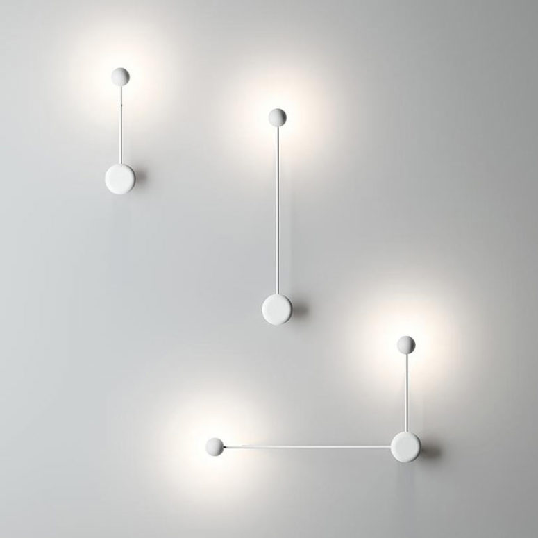 The lamps are available in black and white and you can find wall and sconce versions with similar design
