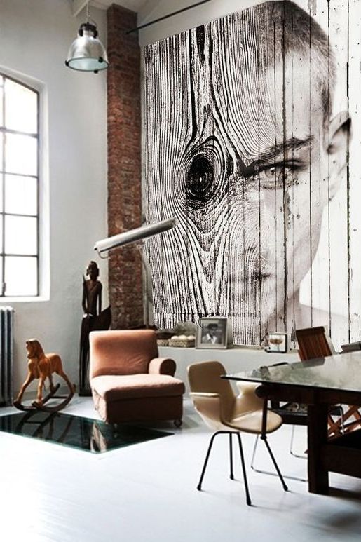 An industrial space with a wall covered with wood and a gorgeous photo art applied right to the wood