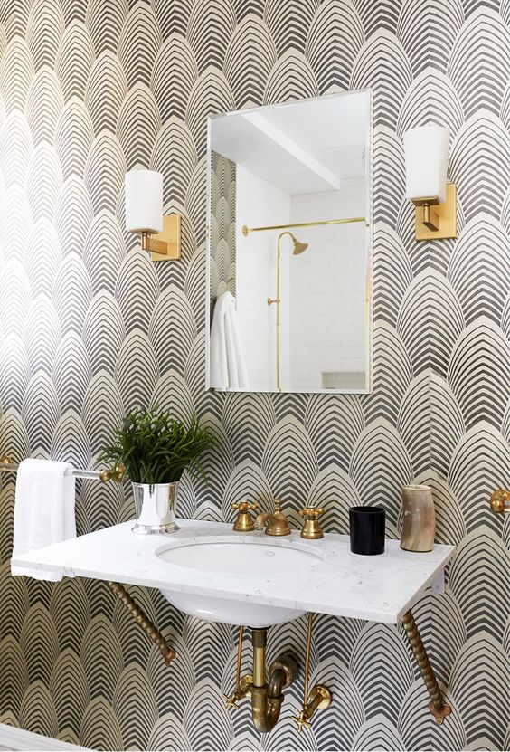 black and white geometric wallpaper is a nice idea for a bold art deco bathroom but keep in mind you need special finishes for wet spaces