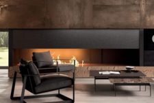 03 a luxurious living room in dark shades with a built-in fireplace and dark furniture for a cool look