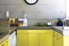 03 an industrial kitchen with lemon yellow cabinets, concrete walls and concrete countertops