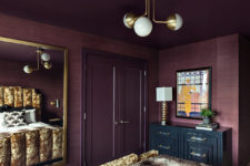 04 Brass touches here and there add chic to the bedroom and you can see a large framed mirror