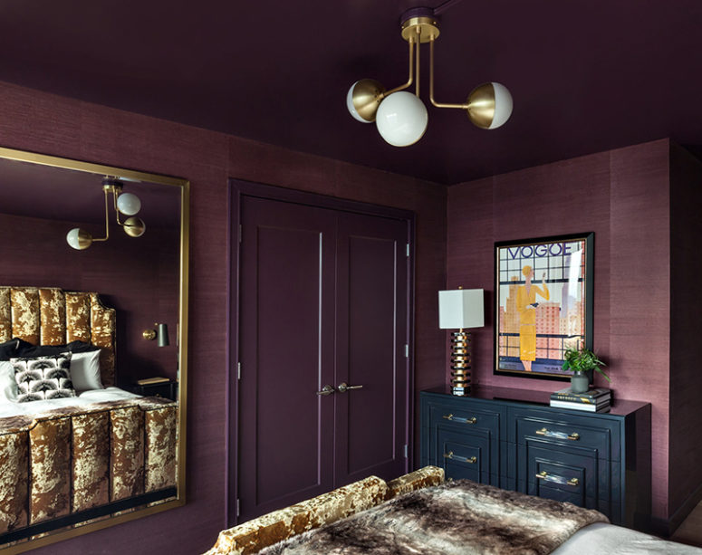 Brass touches here and there add chic to the bedroom and you can see a large framed mirror