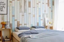 04 a light and airy bedroom with a reclaimed wood pallet wall in different shades