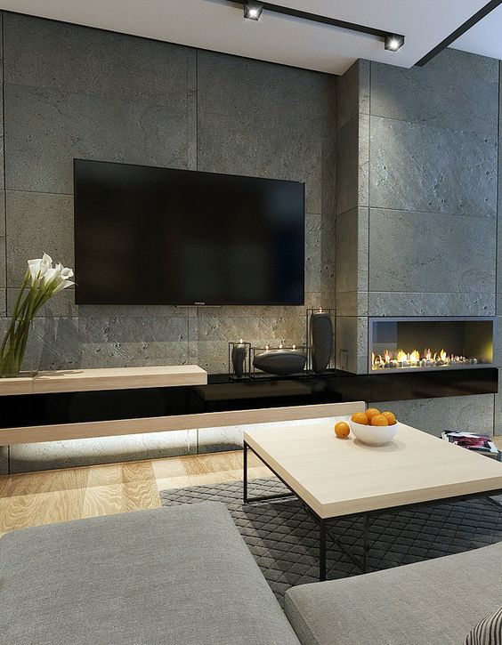 a modenr industrial living room with a built-in fireplace for creating a cozy space