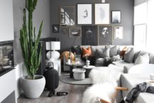 04 a modern space in neutrals with just one black wall, some desert touches and amber accessories