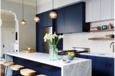 04 navy and white kitchen with marble countertops, bubble pendant lamps and comfy wooden stools