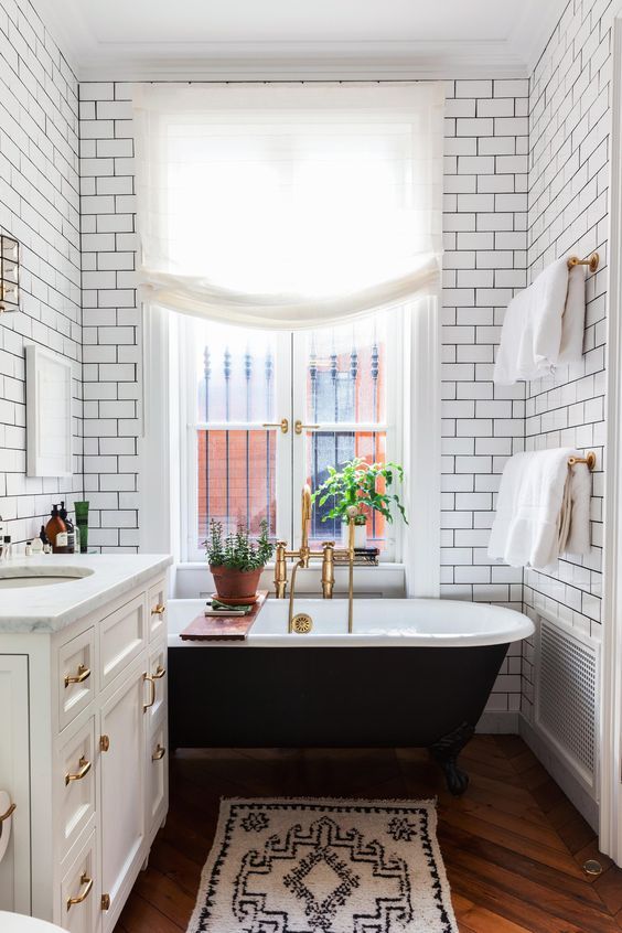 white subway tiles with black grout will be another cool idea for an art deco space