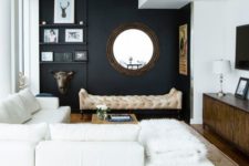 05 a chic modern space with a black wall, creamy furniture, walls and a ceiling and cool accessories and details