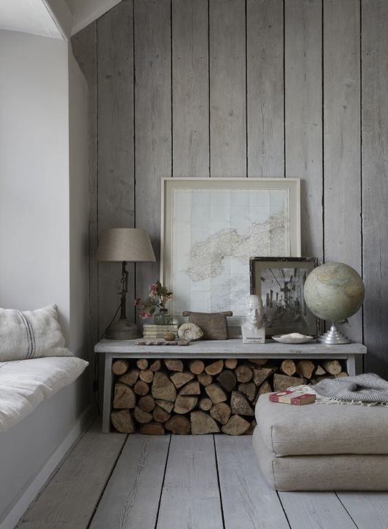 A chic whitewashed space with a wooden wall and floor looks comfy greyish and welcoming