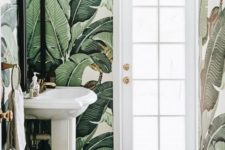 05 eye-catchy banana leaf wallpaper makes the powder room eye-catchy and bold