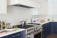 05 navy and white is a timeless combo, which never goes out of style, and a white subway tile backsplash makes the space lighter