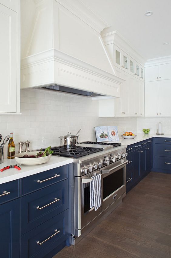 navy and white is a timeless combo, which never goes out of style, and a white subway tile backsplash makes the space lighter
