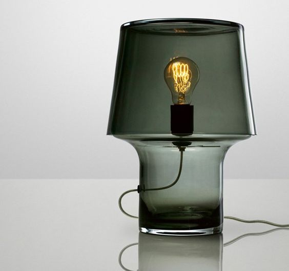 a smoked glass table lamp with a bulb looks very whimsy yet brings coziness