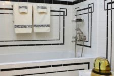06 mosaic white tiles with black geometric patterns clad is a creative and chic idea